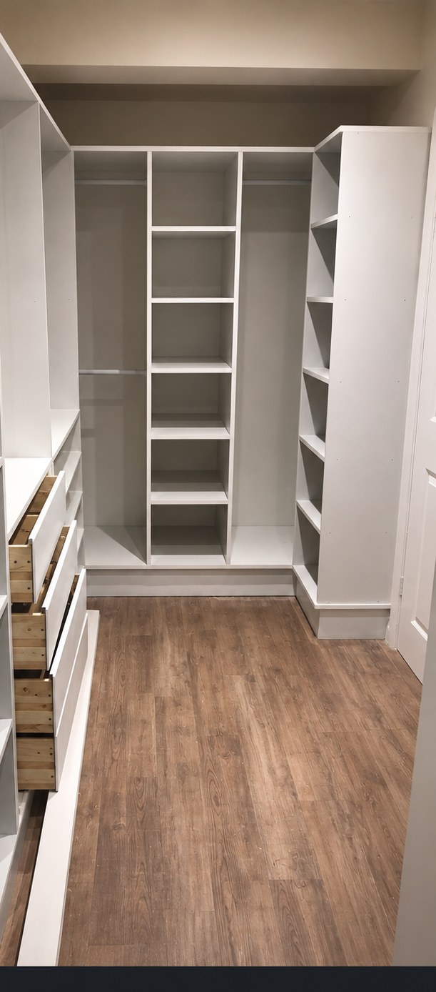 Bespoke fitted walk-in wardrobe with white shelving, hanging rails and drawers installed by Final Touch in Aylesbury